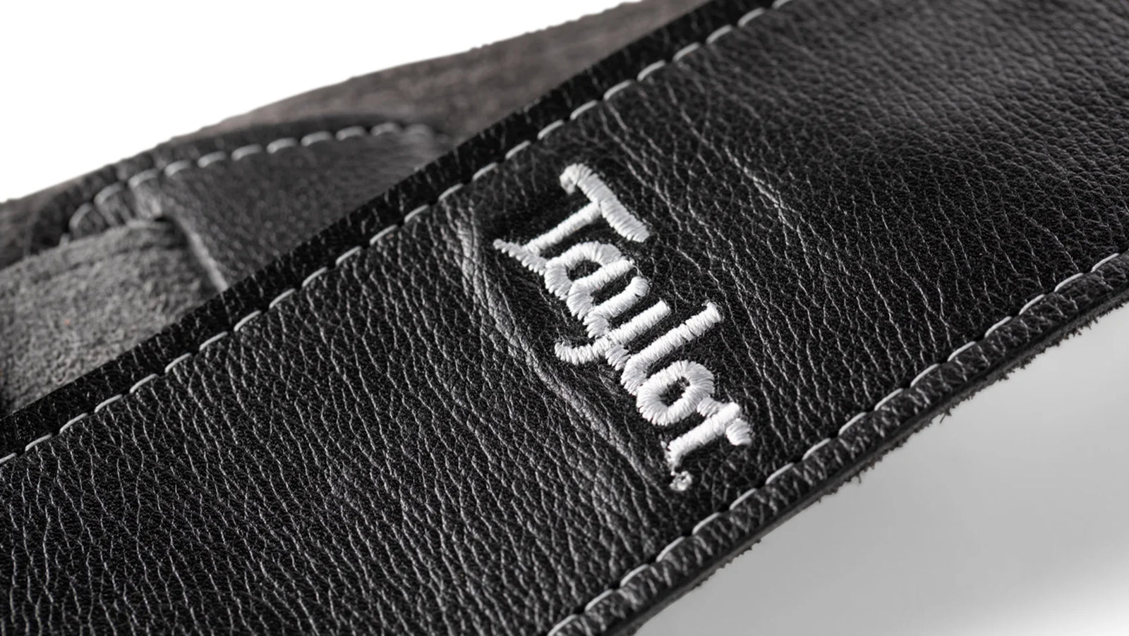 Taylor 2.5" Black Leather Guitar Strap - Black Suede Back with Silver Logo